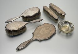 A London silver five-piece ribbon and floral swag engraved dressing set to include a hand mirror: l.