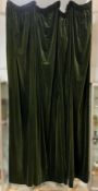 A pair of heavy green velvet curtains, lined: drop 296cm length at top 210cm (2)