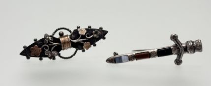 A sterling silver broad sword brooch mounted with bloodstone, cornelian and banded agate panel