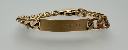 A 9ct cast gold curb link identity bracelet engraved with Duncan and snap fastening: d. x 7cm 42.11g