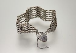 A modern London silver gate link bracelet with heart shaped padlock: d. x 6cm 24.43g