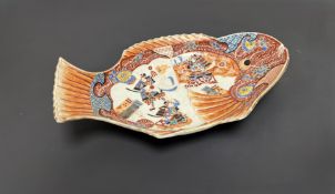 A Japanese Meiji period footed serving plate in the Imari pallette, modelled in the form of a