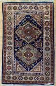 A modern hand-knotted Caucasian kazak carpet, twin central medallions with geometric motifs,