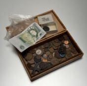 A stained pine box containing a collection of odd coins, a George III copper coin, a Bank of England