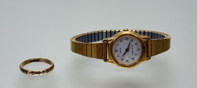 A 9ct gold wedding band L/M 1.91g and a gilt metal quartz wristwatch (2)