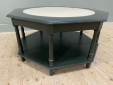 A contemporary painted hardwood coffee table, the octagonal top with painted circle to centre,