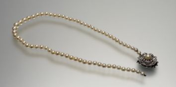 A 9ct white gold scalloped clasp fastening set cultured central pearl and rose cut diamonds in