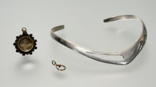 A white metal V shapped torque style necklace: l. x 13cm 41.4g, a 9ct gold ring and loop mount 0.76g