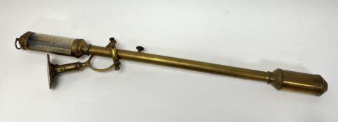 An early 20thc R.N. Desterro of Lisbon brass Ship's stick barometer with wall mounted gimbal