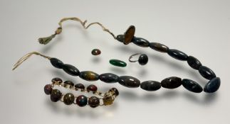 A collection of green hardsone polished pebble jewellery to include a bead necklace: l. x 18cm, a