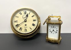 A British brass ship's bulkhead cased Marine wall clock with Trade 