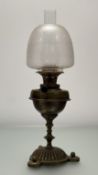 A mid-19thc Young's Central Draught brass oil lamp, with frosted floral etched shade and central