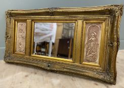 A late 20th century tripartite overmantle mirror, in the Victorian style, the central bevelled plate