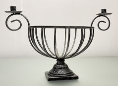 A Modern wrought iron centrepiece with painted piecred basket with twin scrolling candleholders,
