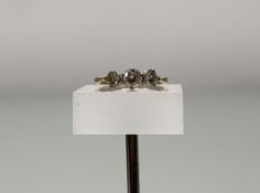 An 18ct and platinum set graduated three stone brilliant cut diamond ring centre stone approximately