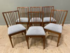 A set of six mid-century teak dining chairs, spar backs over light blue fabric drop-in seats, raised