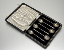 A Birmingham silver set of six coffee spoons: l. x 9cm retailed by Tatton of Edinburgh in original