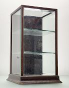 An Early 20thc table top display case, in rectangular form with two tiered glass shelves, with