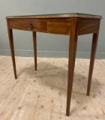 A contemporary oak side table, glass panel top over a central frieze drawer, raised on tapered