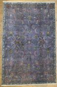 A vintage hand-knotted Persian Tabriz carpet, central panel with scrolling palmettes and all-over