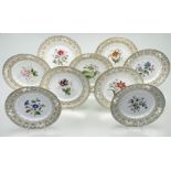 A 19thc porcelain dessert service with various handpainted botanical flowers to centre with a gilt