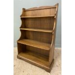 A modern elm kitchen waterfall dresser, by Ercol, with three plate racks to top over open well to