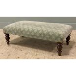 An Edwardian mahogany-framed footstool, cushioned top upholstered in mint green geometric fabric