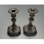 A pair of Italian 800 standard white metal octagonal baluster table candlesticks with fluted