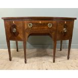 A 19th-century mahogany bow-fronted sideboard, with boxwood inlaid top and inlaid central frieze