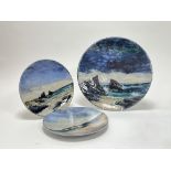 A large Highland Stoneware charger hand-painted with coastal seascape (d. 30cm), together with a