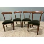 A set of four Victorian mahogany dining chairs, tablet backs over deep green velvet upholstered