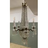 An Edwardian French style cut glass and brass five arm chandelier, with acanthus leaf detail to