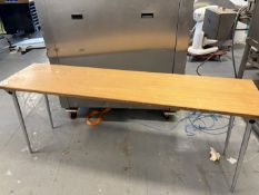 Long wooden table with collapsing legs for stacking