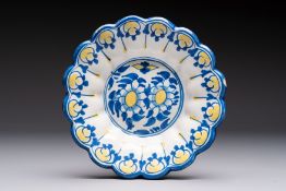 A small polychrome lobed Dutch Delft dish with floral design, 17th C.