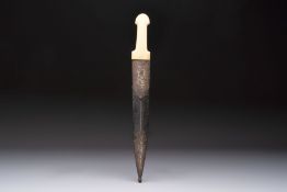 A Caucasian gilt Damascus steel 'Khinjal' with a whale bone hilt and a leather and damascened steel