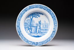 A large blue and white Dutch Delft dish with Jesus and the Samaritan woman, ca. 1680