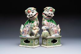 A pair of Chinese verte biscuit models of Buddhist lions, 18th C.