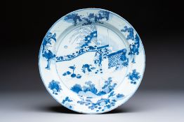 A large blue and white Dutch Delft chinoiserie dish, 17th C.