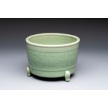 A large Chinese Longquan celadon tripod censer with floral design, Ming
