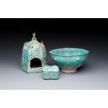 A Nishapur turquoise-glazed bowl, an inkwell and an incense burner or lantern, Iran, 10/12th C.
