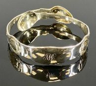 UNUSUAL SILVER BANGLE, formed from Victorian silver sugar nips, London 1865