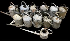 TWELVE ASSORTED GALVANISED METAL WATERING CANS