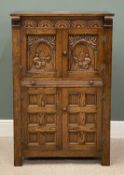 FLEMISH STYLE OAK CARVED CABINET having two cupboard doors over a base of two cupboard doors and