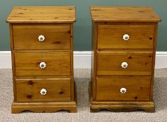 PAIR OF MODERN PINE THREE-DRAWER BEDSIDE CHESTS, ceramic knob handles, 68 (h) x 46 (w) x 43cms (d)