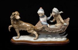 LLADRÓ FIGURINE 'SLEIGH RIDE' #5037, standing on a hardwood velvet covered stand Provenance: