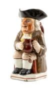 19TH CENTURY TOBY JUG, seated character with frothing jug of ale, clay pipe, and yellow polka dot