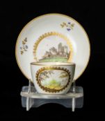 PINXTON TEACUP & SAUCER, early 19th century, bute shape, cup painted with a titled view of