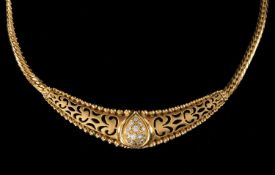 YELLOW METAL PIERCED NECKLACE, set with white stones, the clasp stamped '750', 16.0gms Provenance: