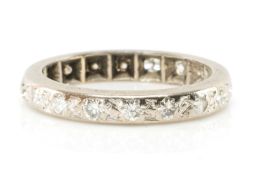 DIAMOND ETERNITY RING, 18 small brilliant cut diamonds illusion-set, unmarked white metal, gross wt.