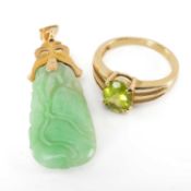 CHINESE JADEITE PENDANT, mounted in yellow metal, 4cms (h); and a peridot mounted 9ct gold ring (